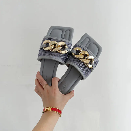 Chaussons plats avec détail de lien en métal noir